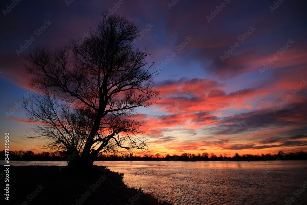 Colorful sunset by the Odra River, Germany.