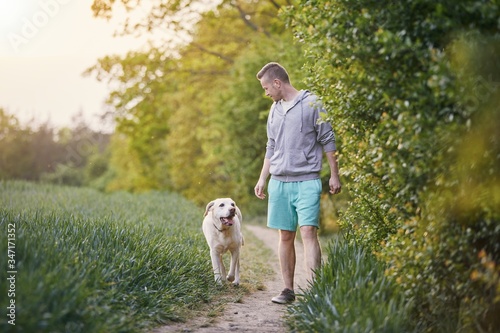 Man with dog on footpath