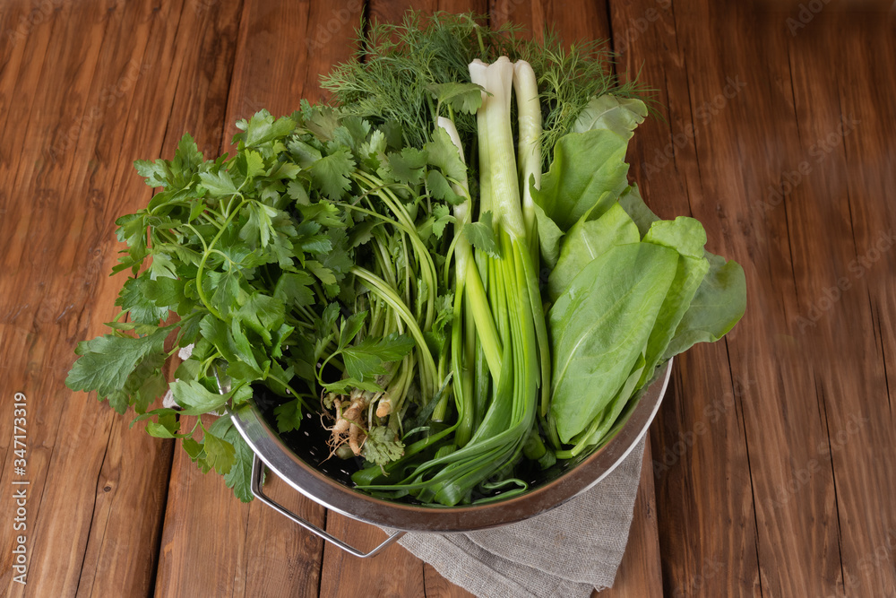 Fresh chives, dill, parsley, cilantro and sorrel on a wooden background Fresh chives, dill, parsley, cilantro and sorrel on a wooden background