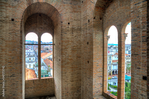 View of downtown Cuenca  Ecuador  from inside one of the towers of the Cuenca Cathedral  on a sunny morning.
