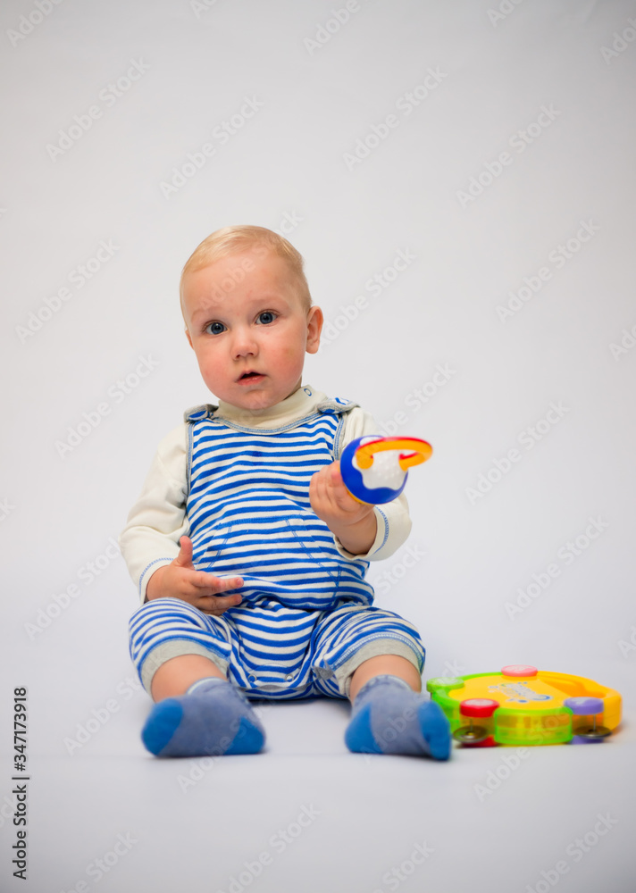 Cute funny caucasian baby toddler infant kid boy with toys Cute funny caucasian baby toddler infant kid boy with toys