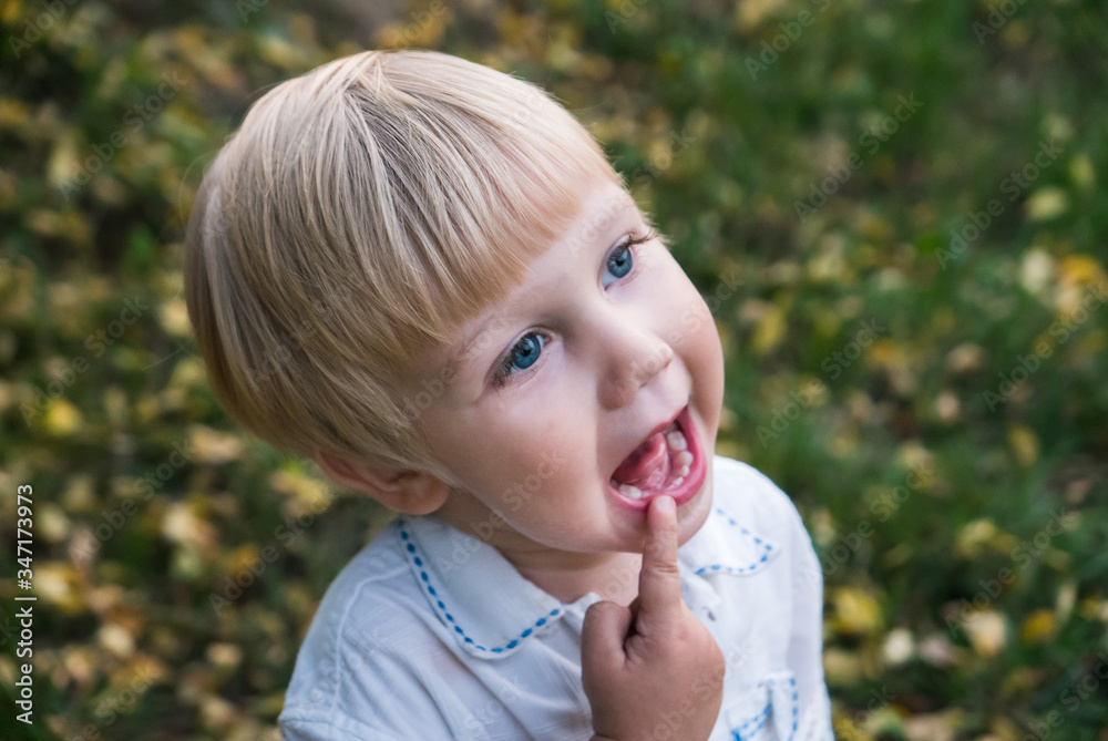 Cute funny caucasian toddler kid child boy with finger in mouth Cute funny caucasian toddler kid child boy with finger in mouth
