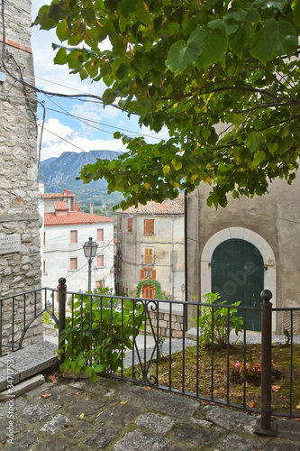 A narrow street between old buildings in the medieval town of Cusano Mutri, in the province of Avellino photo