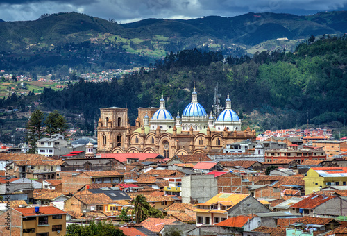 Cuenca's Cathedral La Inmaculada Concepcion, in middle of it's beautiful city, on a sunny and cloudy afternoon. Cuenca, Azuay Province, Ecuador. photo