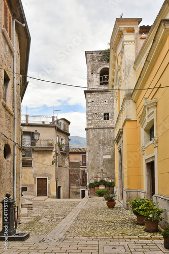 A narrow street between old buildings in the medieval town of Cusano Mutri, in the province of Avellino