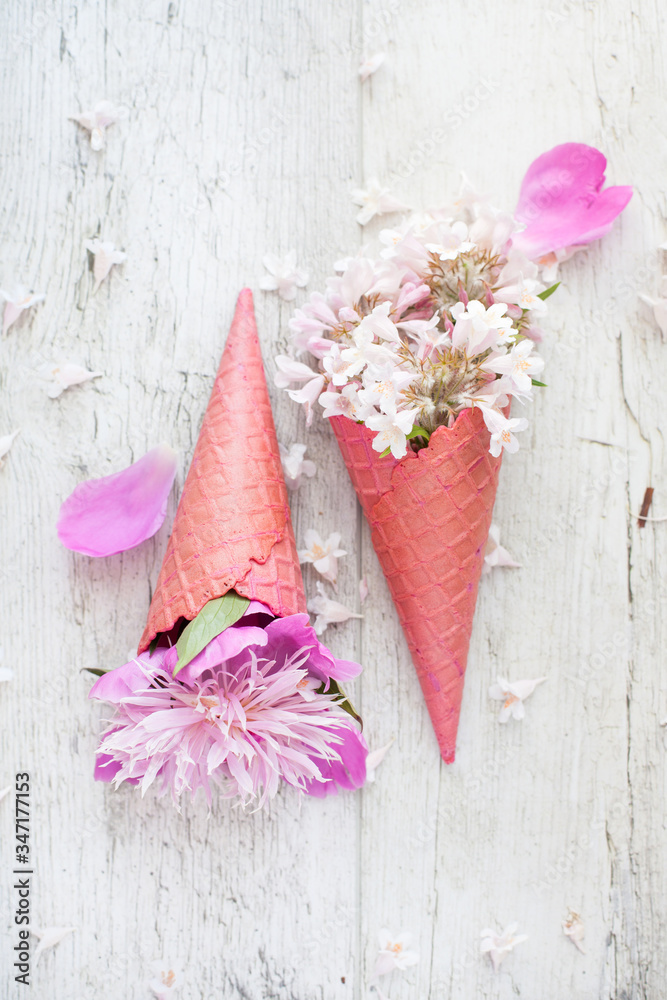 Bouquet - flower ice cream. Pink flowers in an ice cone