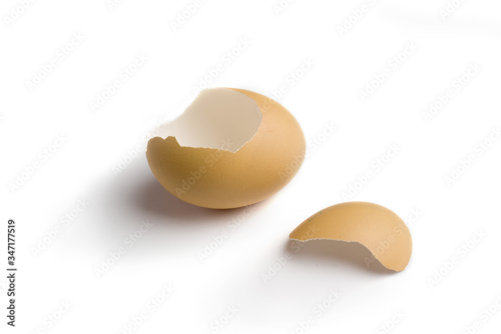 The shell of the broken light brown eggs isolate white background The shell of the broken light brown eggs isolate white background