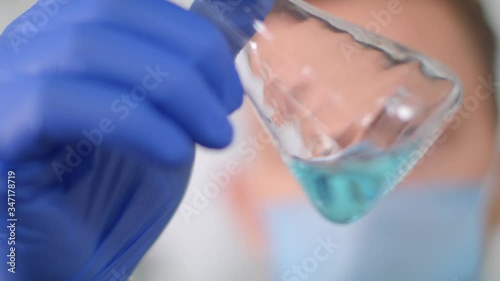 Medical man takes a flask with an antiseptic.Coronavirus protection. Healthcare service.