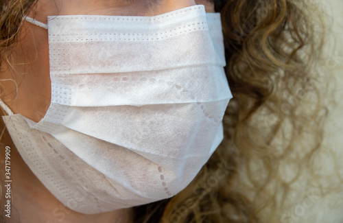 masked woman taking corona virus precaution