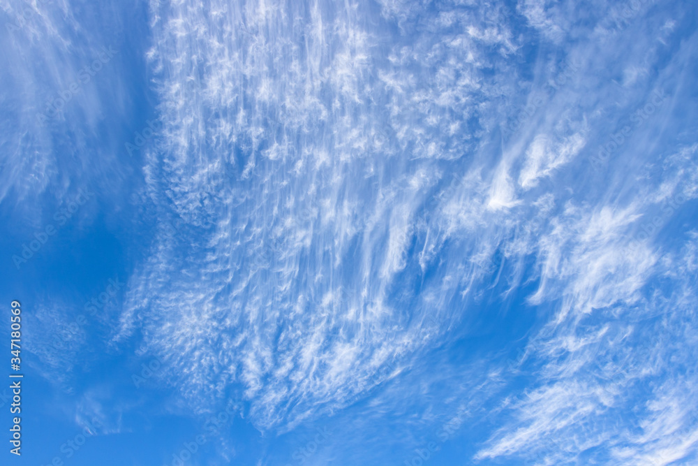 Clear blue sky and white clouds.