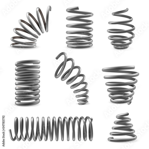 Set of various shaped metal springs tapering, expanding in different places. Compressed, extended coils.