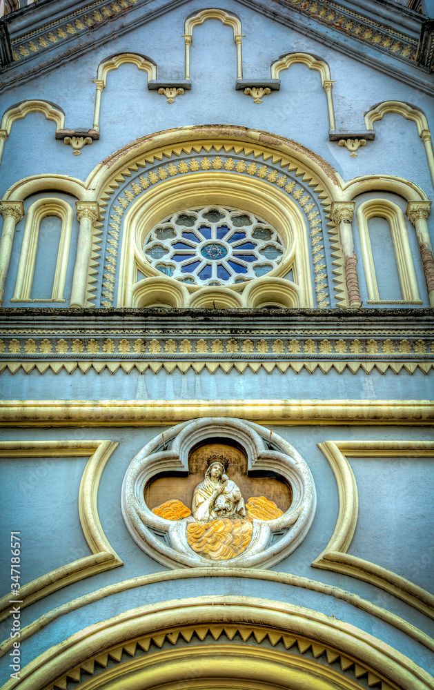 Fototapeta premium View of the facade of the San Alfonso church in Cuenca, Ecuador. Constructed in the late 1800s, the church is located about a block from the city's central square Calderon Park.