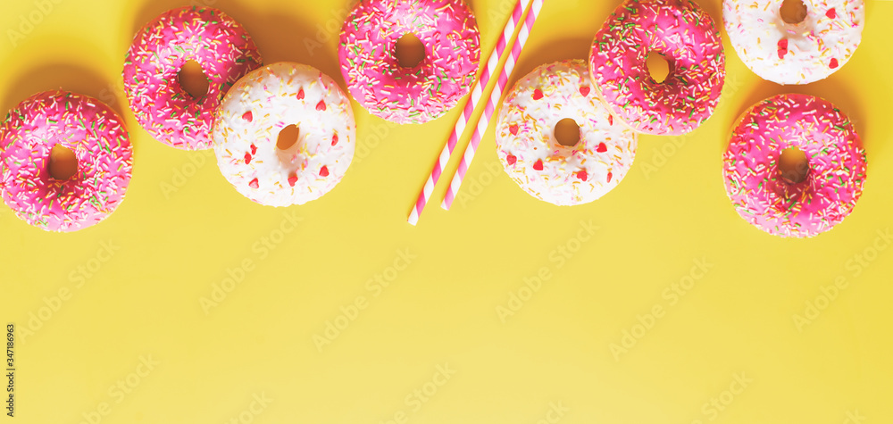 Obraz premium Flat lay with pink donuts or doughnuts pattern, vertical, on yellow background