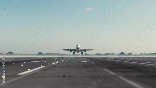 Airplane takes off over head. Airplane taking off from the airport.  photo
