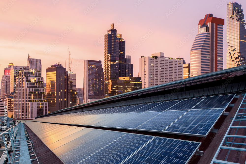 Solar Panel Photovoltaic installation on a Roof of factory, sunny blue sky background, alternative electricity source - Sustainable Resources Concept. Solar Panel Photovoltaic installation on a Roof of factory, sunny blue sky background, alternative electricity source - Sustainable Resources Concept.