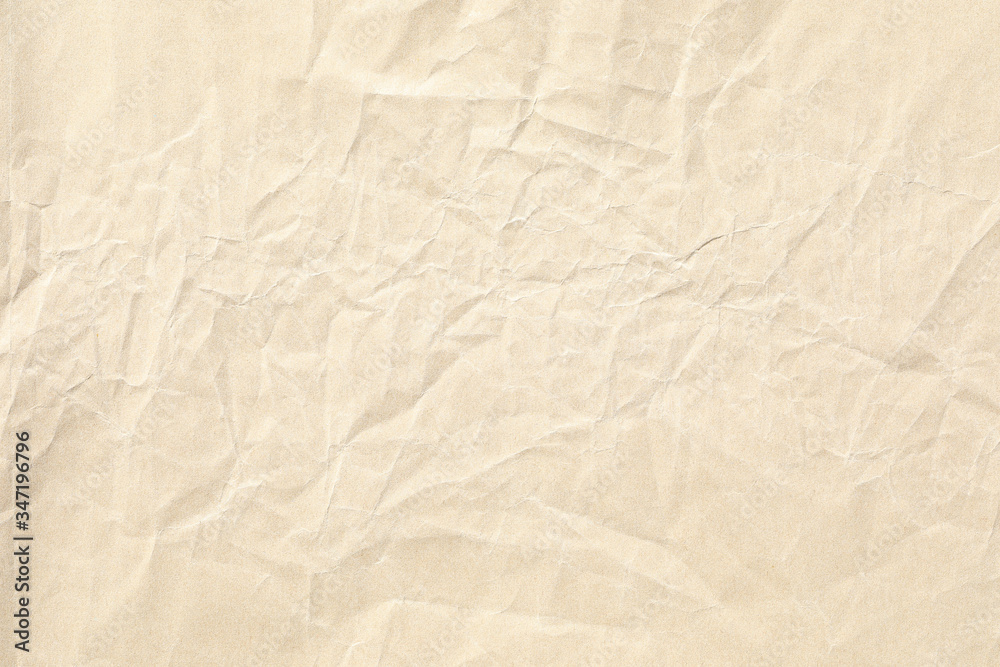 Obraz premium Crumpled brown paper background texture