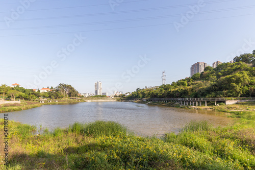 Landscape of urban reservoir Park and modern buildings in Xiamen city in China