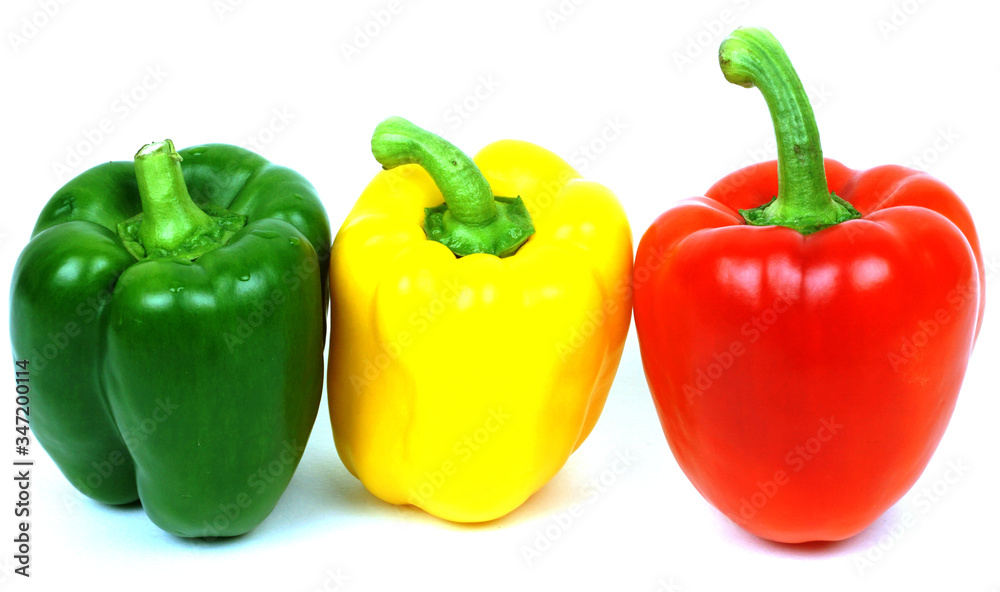 Red, yellow and green peppers, traffic light colours isolated on white background Red, yellow and green peppers, traffic light colours isolated on white background