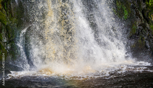 Splashing water at the bottom of a waterfall