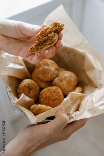 plate of cookies in heands on parchment paper photo