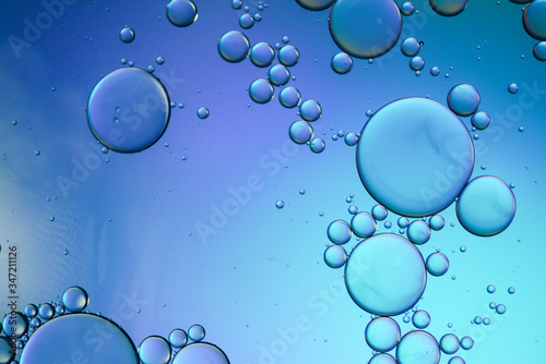 Colorful artistic of oil drop floating on the water. Abstract bubble background.