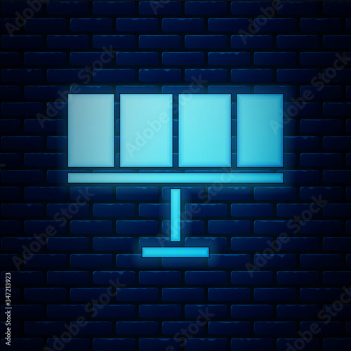 Glowing neon Solar energy panel icon isolated on brick wall background.  Vector Illustration