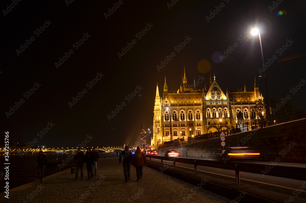 Night scenery at Budapest, the capital city of Hungary, with silhouette of people along the street.