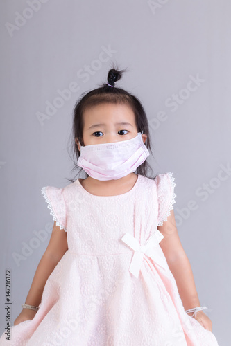Little girl wearing mask for protect © nagritsamon