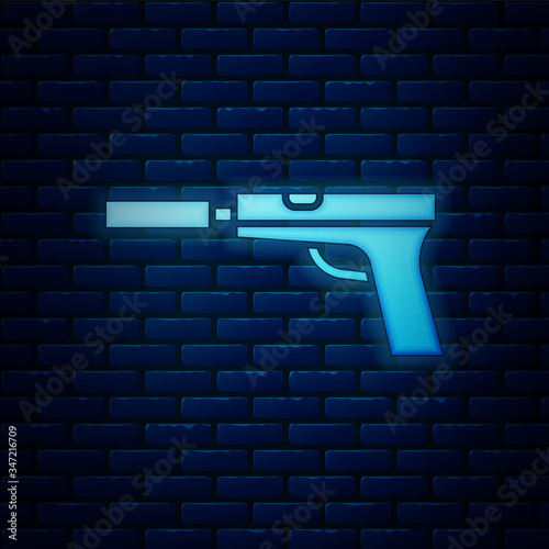 Glowing neon Pistol or gun with silencer icon isolated on brick wall background.  Vector Illustration