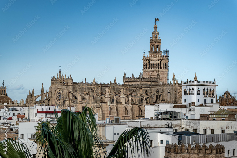 Seville, Spain, November 14, 2019: Cathedral of Seville with blue sky