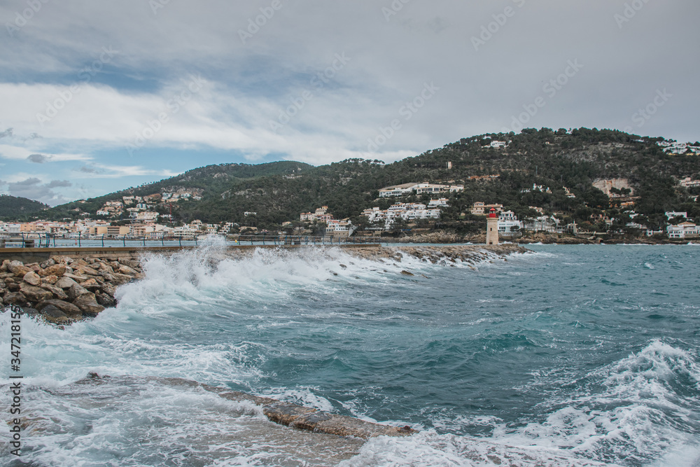 Puerto de Andratx, Spain, Abril 6, 2019: wind at the sea with lighthouse