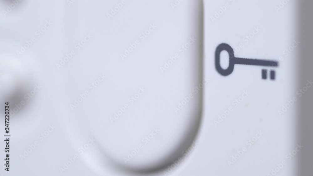 Macro detail of door bell being pressed Macro detail of door bell being pressed