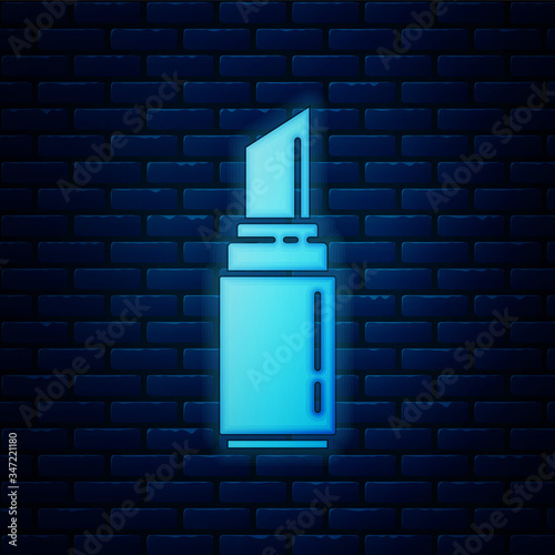 Glowing neon Lipstick icon isolated on brick wall background. 8 March. International Happy Women Day.  Vector Illustration