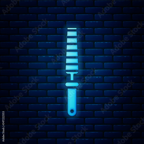 Glowing neon Chisel tool for wood icon isolated on brick wall background.  Vector Illustration