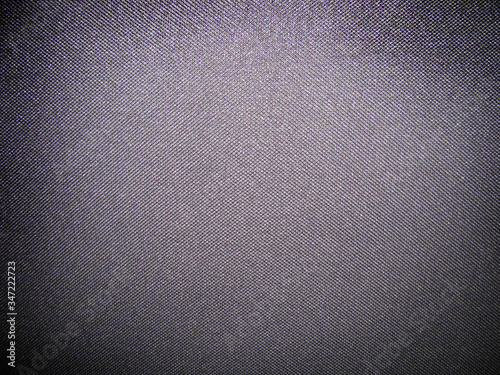 the texture of the fabric. dark background of textile material.