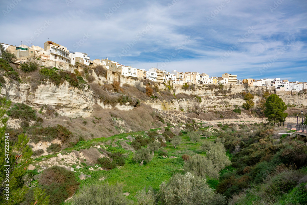 Residential buildings on the edgo of high rock in Sorbas, Spain, Almeria, Andalusia.