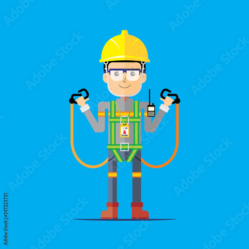 Worker showing how to wear the right safety full body harness with double lanyard.