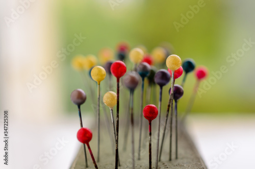 Abstract background of Colored Pins on needle case