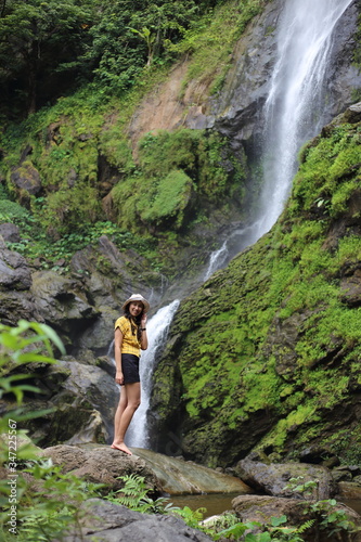 Women enjoying nature at Klong Lan waterfall in Klong Lan national park at Kamphaeng Phet  Thailand 