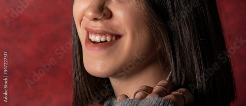 Close up of young woman with nose piercings