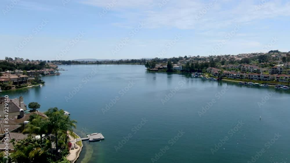Aerial view of Lake Mission Viejo, with recreational facilities, surrounded by private residential and condominium communities. Orange County, California, USA Aerial view of Lake Mission Viejo, with recreational facilities, surrounded by private residential and condominium communities. Orange County, California, USA