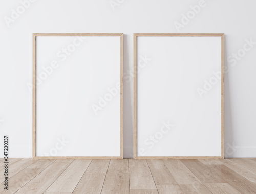 Set of 2 Wooden frames a3  a4  frame mock up on white wall standing on wooden floor. Poster mock up. minimal frames. Empty frame Indoor   3D render  3D illustration