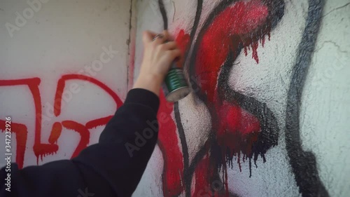 Closeup Of Urban Teen Drawing Graffitti On Wall