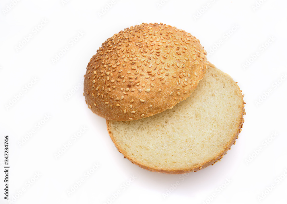 Fresh fragrant bun for burgers with sesame seeds on a white background. Can be used for advertising