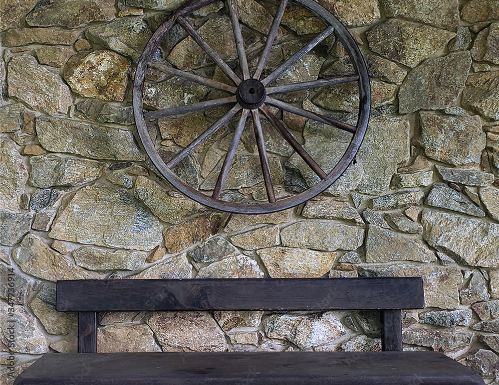 Wheel on Stone Wall