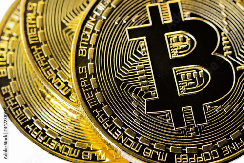 Crypto currency Closeup Golden Bitcoins. Photo virtual money.Blockchain technology, bitcoin mining concept.