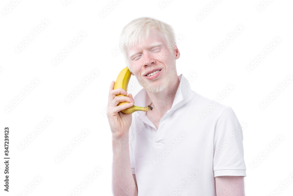 portrait of an albino man in studio dressed t-shirt isolated on a white background. abnormal deviations. unusual appearance