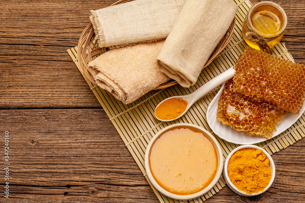 Spa concept. Self care with honey and turmeric. Natural organic cosmetics, homemade product, alternative lifestyle. Vintage background Spa concept. Self care with honey and turmeric. Natural organic cosmetics, homemade product, alternative lifestyle. Vintage background