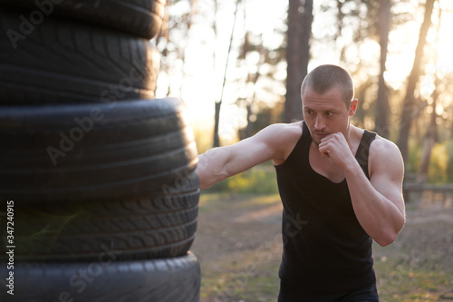 Man fighter training boxing outdoor fitness workout