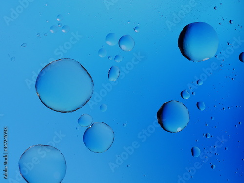 Oil on water abstract background with bubbles
